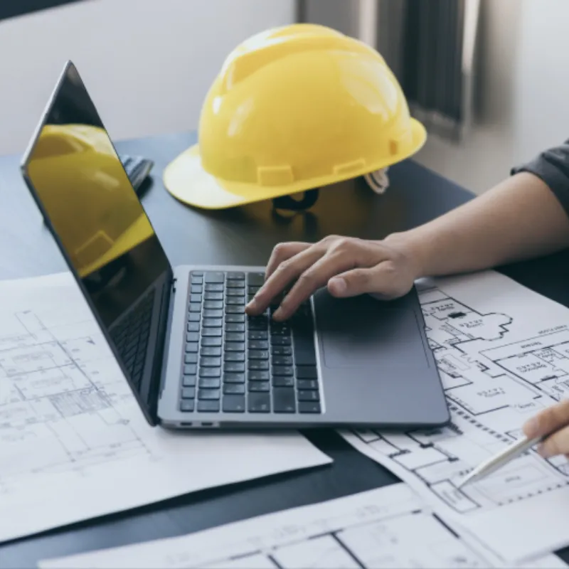 Contractor reviewing marketing leads on laptop